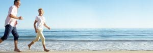 couple running on the beach