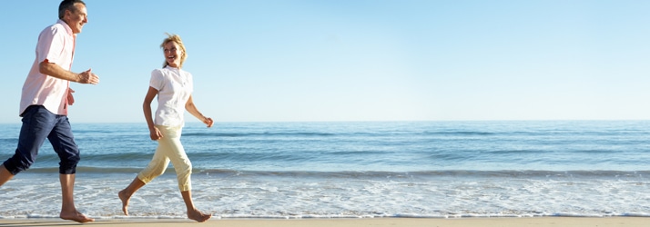 couple running on the beach